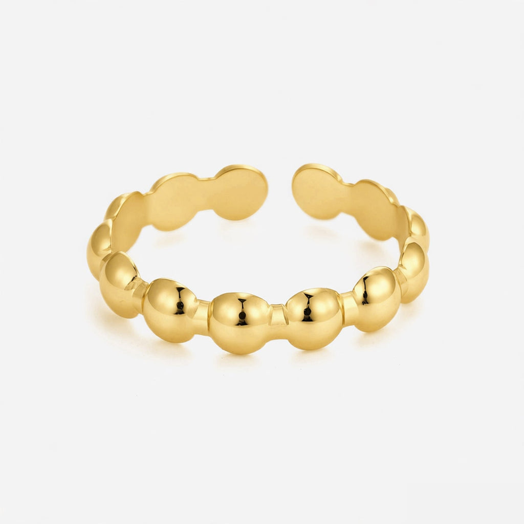 Anillo con motivos ovalados dorados