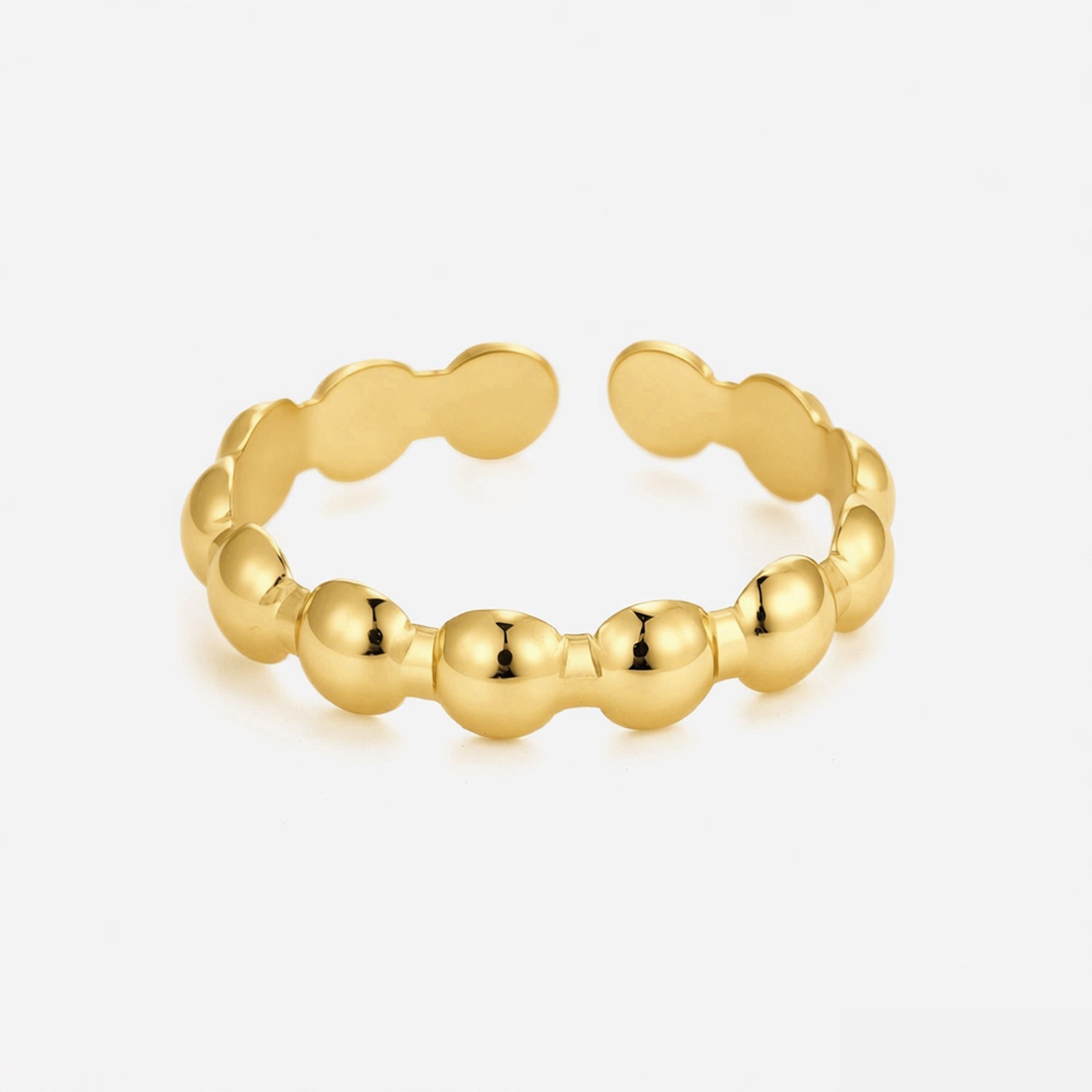 Anillo con motivos ovalados dorados