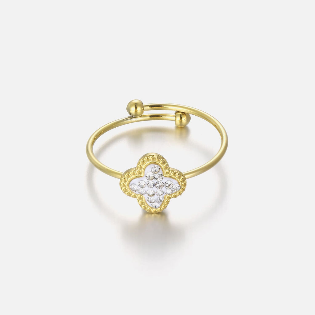 Anillo de trébol con piedras doradas